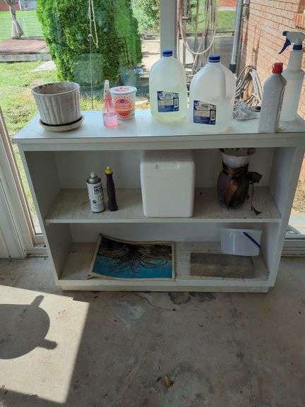 White Shelf Unit with Various Items image
