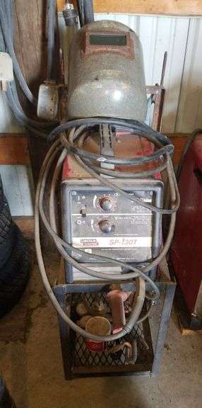Lincoln Electric Arc Welder, Model SP-130T, On Rolling Cart, With Gloves And Metal Helmet, Bidder Responsible For Proper Removal