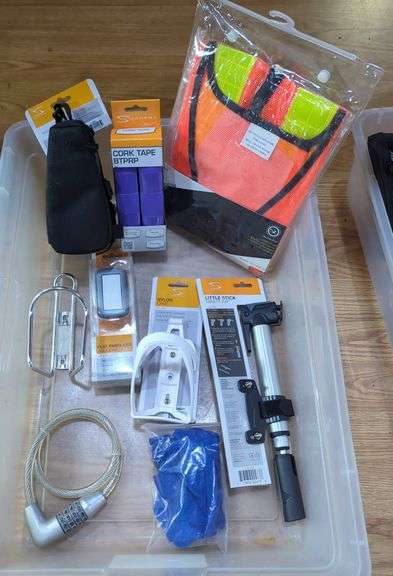 Bicycle Accessories Including Serfas Mini Pump, Headlight, Cable Lock, Cork Tape, Bottle Cage And More, Contents Of Tub image