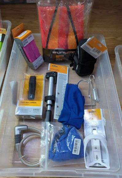 Bicycle Accessories Including Serfas Mini Pump, Headlight, Cable Lock, Cork Tape, Bottle Cage And More, Contents Of Tub image