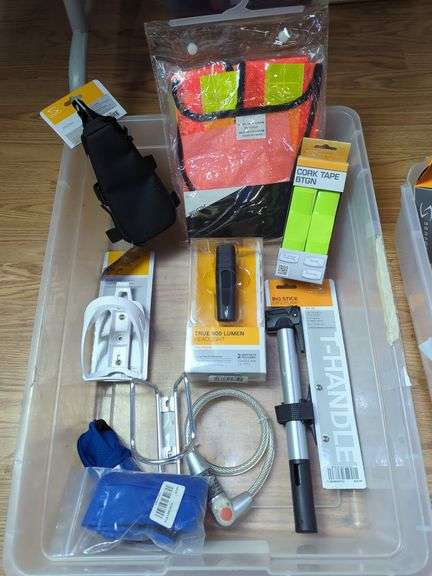 Bicycle Accessories Including Serfas Mini Pump, Headlight, Cable Lock, Cork Tape, Bottle Cage And More, Contents Of Tub image