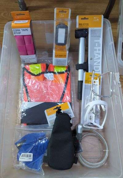 Bicycle Accessories Including Serfas Mini Pump, Headlight, Cable Lock, Cork Tape, Bottle Cage And More, Contents Of Tub image