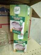 Home Canning Supplies Including Ball Jars, Jug, Book, and Accessories