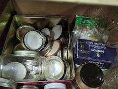 Home Canning Supplies Including Ball Jars, Jug, Book, and Accessories