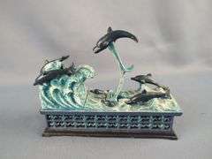 PuzzleMakers International Cast Iron Mechanical Dolphins Bank