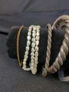 Collection of 9 Bracelets including Pearl, Flower Motif