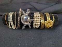 Collection of 9 Bracelets including Pearl, Flower Motif