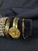 Collection of 9 Bracelets including Pearl, Flower Motif