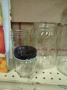 Home Canning Supplies Including Ball Jars, Jug, Book, and Accessories