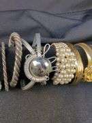 Collection of 9 Bracelets including Pearl, Flower Motif