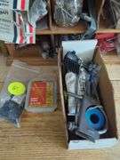 Wall-Mounted Wooden Shelf with Assorted Hardware and Tools