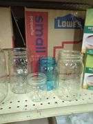 Home Canning Supplies Including Ball Jars, Jug, Book, and Accessories