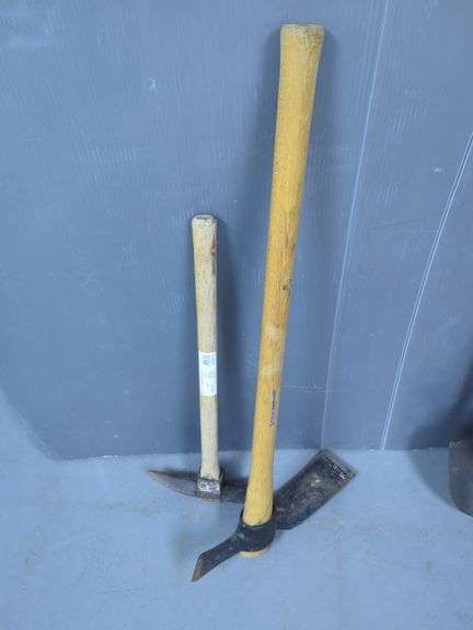 Variety of Shovels, Picks and a Metal Stand