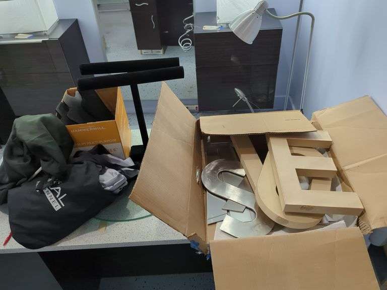 Metal & Cardboard Letters And Black Jewelry Displays