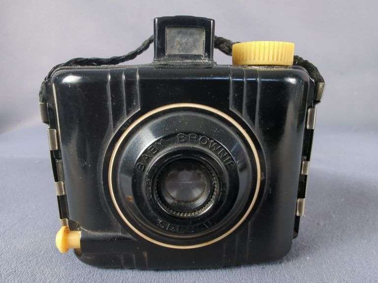 Collection of Cameras including Kodak Baby Brownie, Polaroid, Digital, and Flash Bulbs