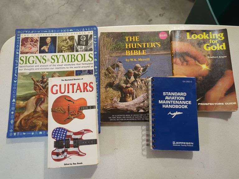 Books Including Guitar Directory, Signs and Symbols, Hunter's Bible, Prospector's Guide, Aviation Handbook