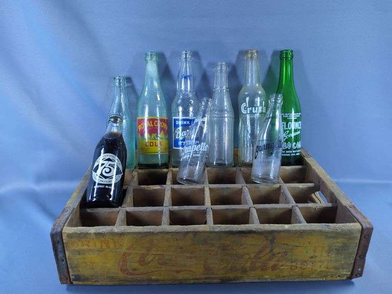 Assorted Vintage Soda Bottles In Coca-Cola Crate