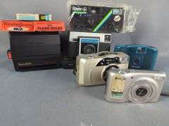 Collection of Cameras including Kodak Baby Brownie, Polaroid, Digital, and Flash Bulbs
