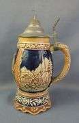 German Beer Stein with Pewter Lid and Relief Decoration