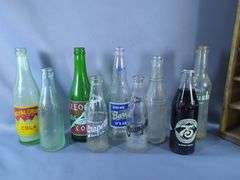 Assorted Vintage Soda Bottles In Coca-Cola Crate