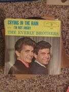 Collection of 45 RPM Records with Cases Including Elvis Presley, Shaun Cassidy, and More