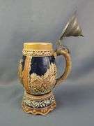 German Beer Stein with Pewter Lid and Relief Decoration