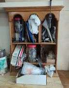 Wall-Mounted Wooden Shelf with Assorted Hardware and Tools
