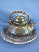 Variety of Vases, Teapots, and Cups