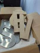 Metal & Cardboard Letters And Black Jewelry Displays