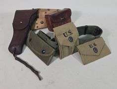 G&K 1917 US Embossed Leather Holster On Web Belt With Leather Pouch, And Web Belt With 1942 Dated Pouches, And More