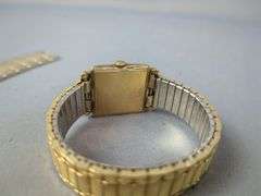 Bulova Diamond Quartz Watch, Marked On Back 18K Gold No. 2120 Swiss Made, And Bulova 23 Jewels Watch, Marked 10K Rolled Gold Plate