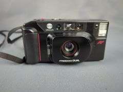 Polaroid Impulse SE, Kodak VR35, and Minolta Freedom Dual Cameras with Cases