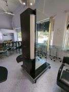 Double Sided Salon Styling Station With Rollout Storage And Power Supply On Casters