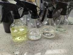 Salon Supplies Including Spray Bottles, Combs, Brushes, Mirror & Barbicide Jar