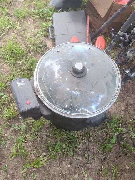 Camping Gear Including Fishing Rods, Net, Cooking Pot, and More