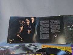 Collection of 12" Vinyl Records: Pink Floyd, The Doors, REO Speedwagon, and More