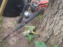 Camping Gear Including Fishing Rods, Net, Cooking Pot, and More