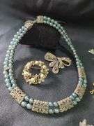 Costume Jewelry Including Necklace, Bracelets, and Brooches