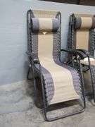 Two Adjustable Zero Gravity Lounge Chairs