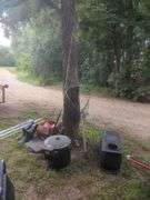 Camping Gear Including Fishing Rods, Net, Cooking Pot, and More