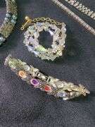 Costume Jewelry Including Necklace, Bracelets, and Brooches