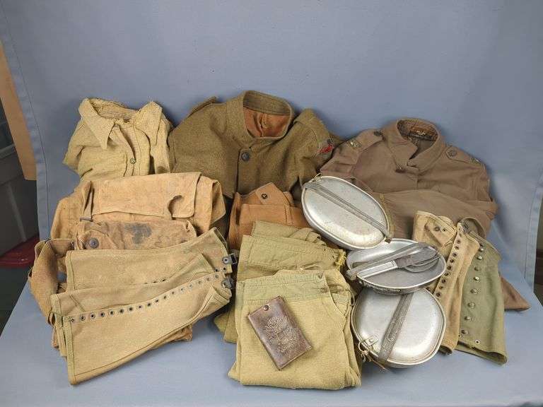 WWI Military Clothing And Accoutrements, Includes Jacket With 30th Infantry Insignia, Military Trousers, Qty 2, Shirts, Qty 2  (One With Insignia), Underwear Bottoms, Qty 2, Leggings, Qty 4, Mess Kits And Utensils Dated 1918 (Knife 1917), US Army Wallet, Backpack, And Shoulder Bag image