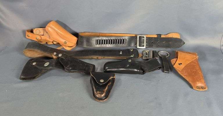 Leather Holsters, Includes Bucheimer Clark Deputy B16-34, Jay-Pee Lawman, Milwaukee Saddlery Co. US Marked Holster, And Shoulder Holster, Leather Handcuff Holster, And Dehner's No. 36 And No. 37 Leather Belts, One With Ammo Holders, One Needs Assembled image