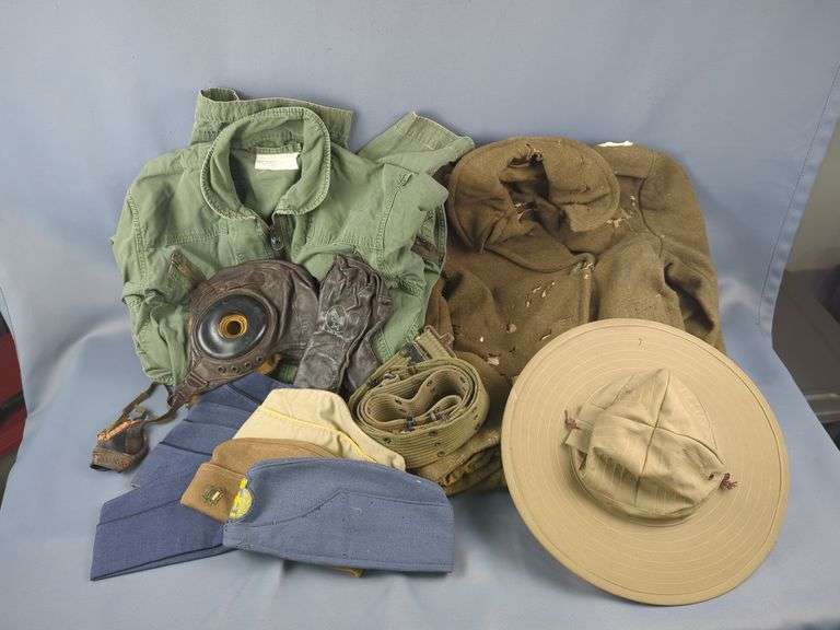 Military Uniform, Includes US Military Flying Coveralls, US Air Force Leather Cap And Glove, Air Service Leather Goggles, WWII Winter Jacket With Holes And Paint Stain, US And Foreign Military Caps, And Web Belts image