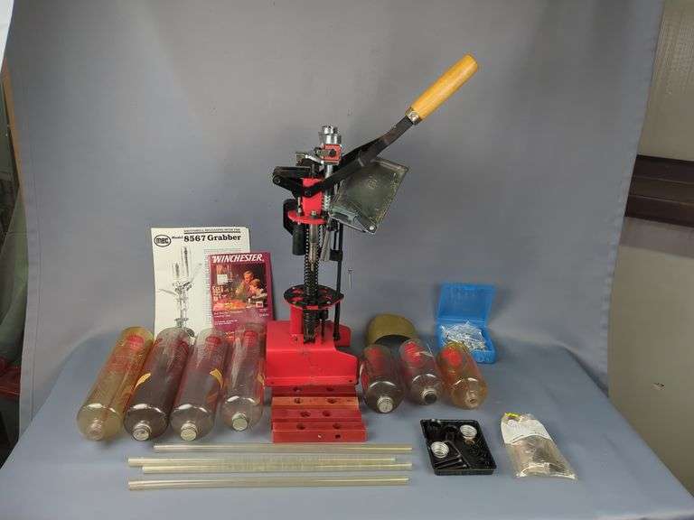 MEC Reloading Press Model 8567 Grabber With Instructions, Case Feeder Tubes, Charging bars, Various Sized Powder Bottles, Powder Bushings, And More image