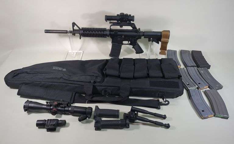 Bushmaster Firearms XM15-E2S 5.56 Nato Rifle SN# L038732, 1/9 H Bar Bbl, Adjustable Stock, 9 Total Mags, Bushnell Trophy Red Dot Sight, Brass Catcher, Vertical Foregrips, Qty 2 (1 Becomes Bipod), Simmons 3-9x40 Scope, Undermount Flashlight, LaserLyte Bore Sighter, Sightmark Bore Sighter, Bipod, Paperwork, And More, In Tactical Soft Case image