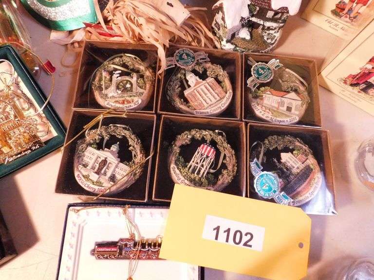 Lot of Christmas Decorations, Paper and Ornaments, Dickens Village Ceramic Candle Holder, 6 Bowling Green Commemorative Ornaments, Approximately 17 Internation Santa Claus Collection with Boxes, Approximately 3 Lenox Collection Ornaments