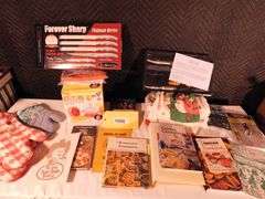 Lot of Kitchen items oven mitts, towels, shammy, citrus express, Boston Warehouse spreaders, cook books, Extension cords