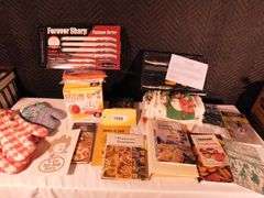 Lot of Kitchen items oven mitts, towels, shammy, citrus express, Boston Warehouse spreaders, cook books, Extension cords