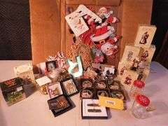 Lot of Christmas Decorations, Paper and Ornaments, Dickens Village Ceramic Candle Holder, 6 Bowling Green Commemorative Ornaments, Approximately 17 Internation Santa Claus Collection with Boxes, Approximately 3 Lenox Collection Ornaments